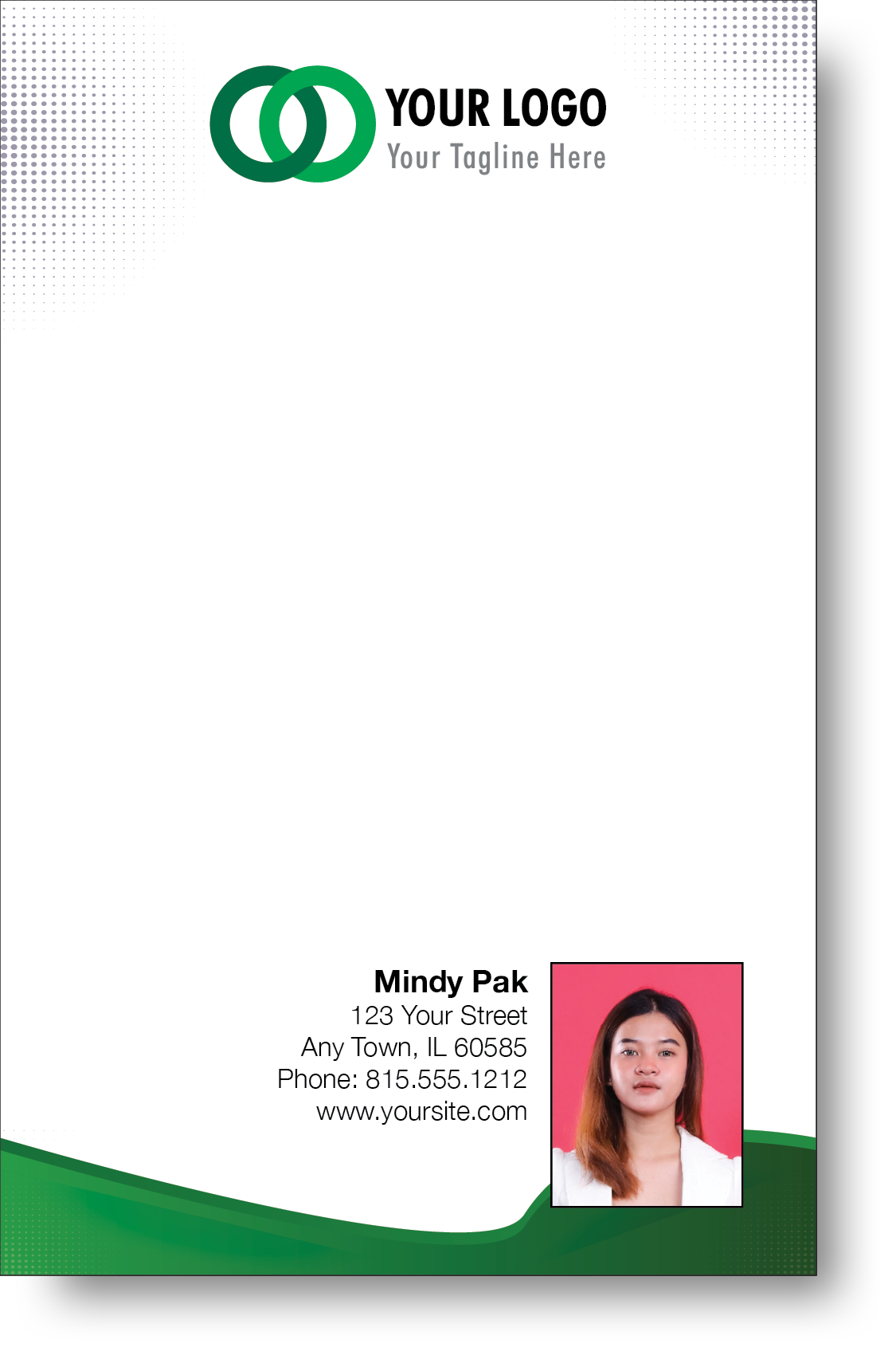 A colorful professional notepad presenting a company logo and a portrait with a name and contact information displayed.