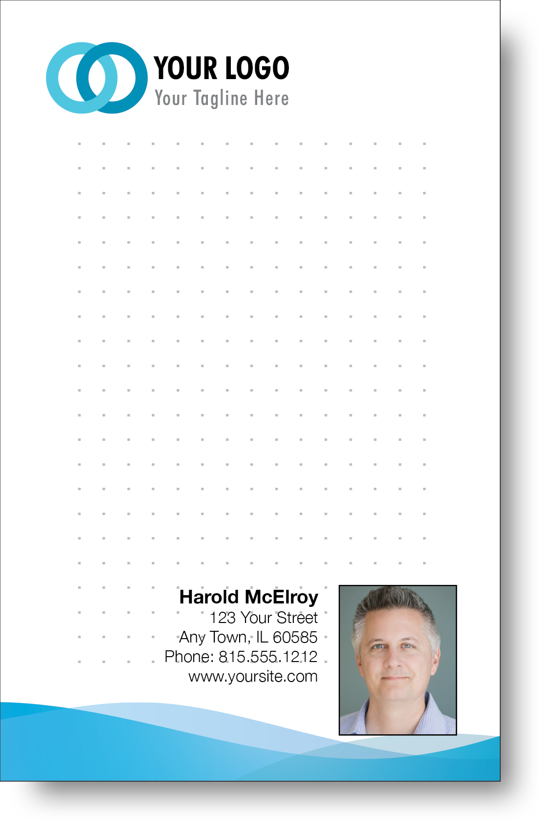 A colorful professional notepad presenting a company logo and a portrait with a name and contact information displayed.