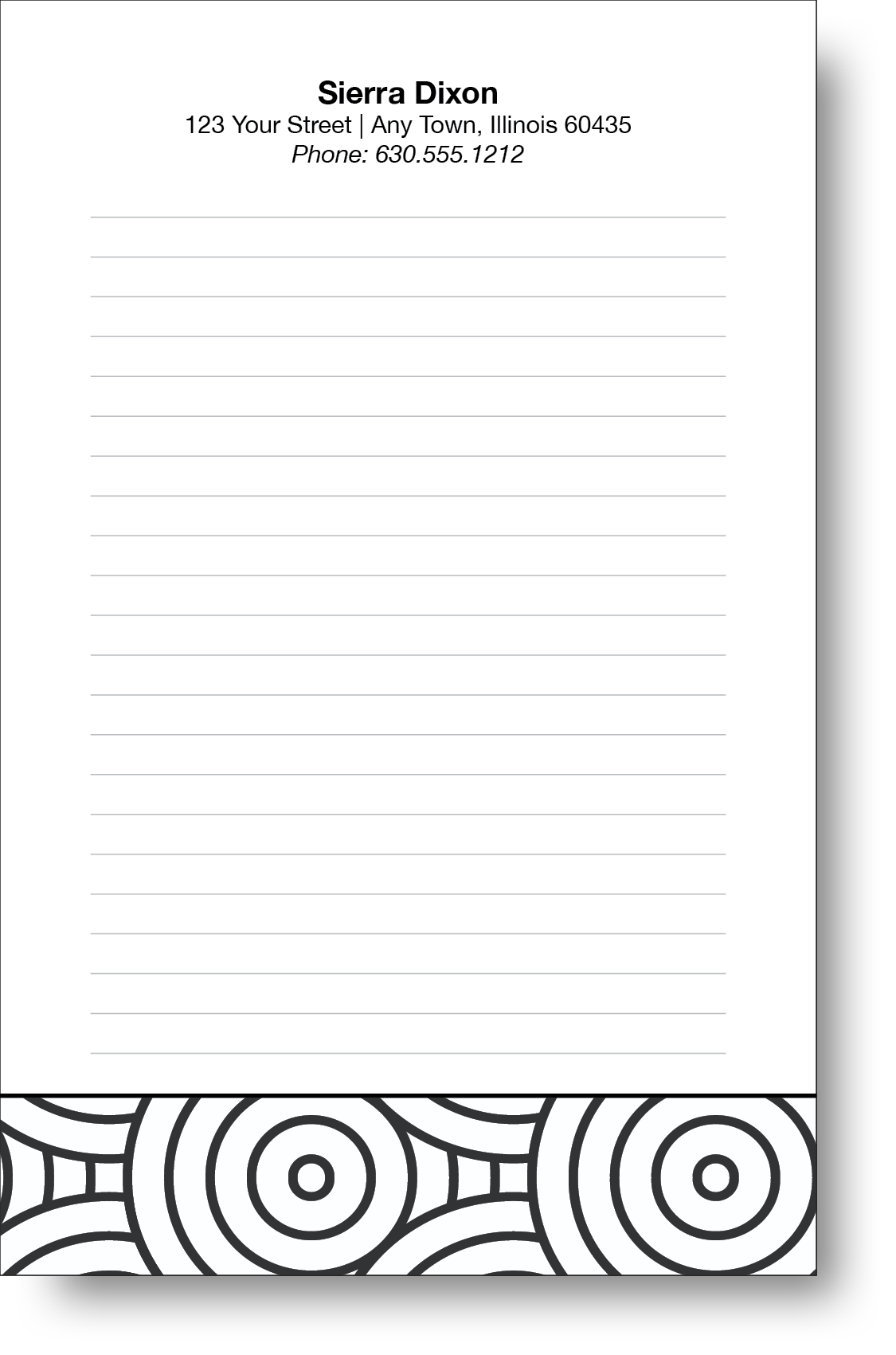A black and white notepad with a geometric design on the bottom and a name and contact information on the top.
